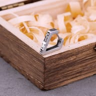 Side profile showing hinged clasp mechanism on geometric stainless steel earrings